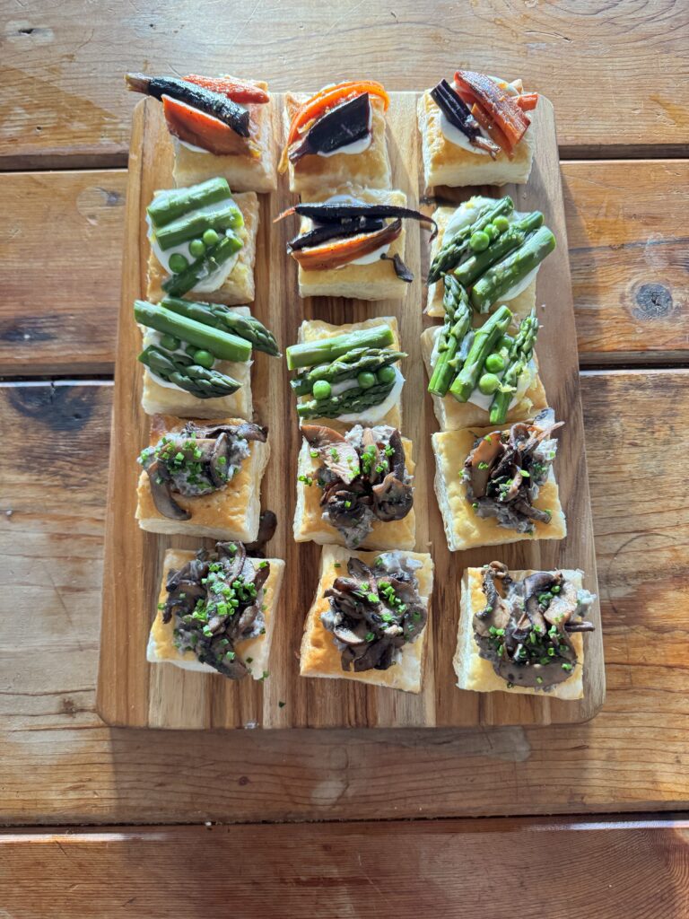 catering image of spring vegetable tarts with asparagus, mushroom and carrots